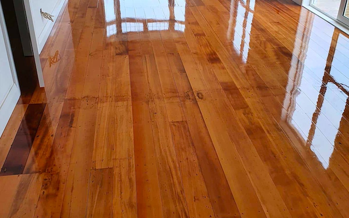 Moisture cured polyurethane on glossy native rimu floorboards in an Auckland villa