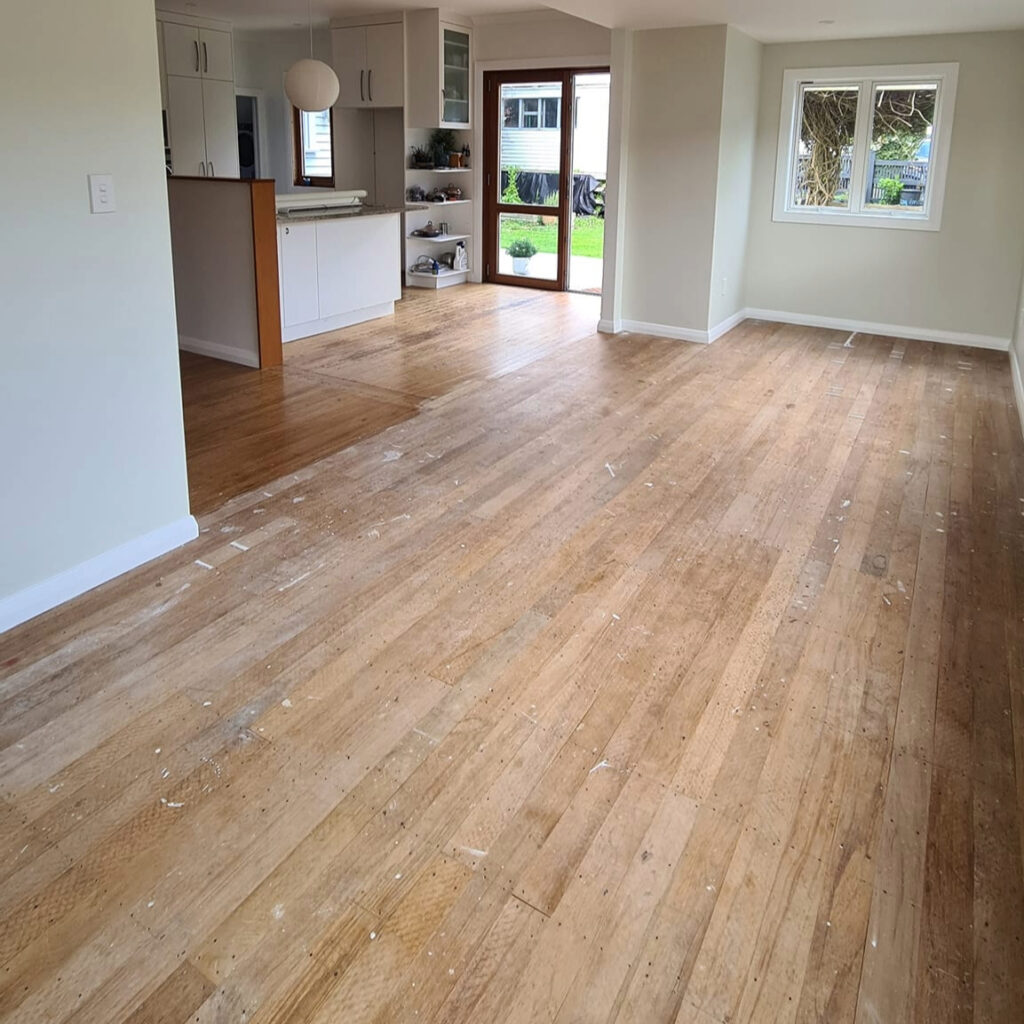 Worn timber floorboards before sanding